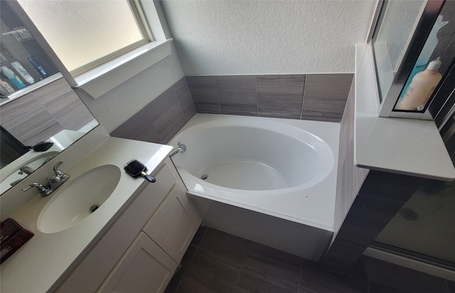 bathroom featuring vanity and a bathtub