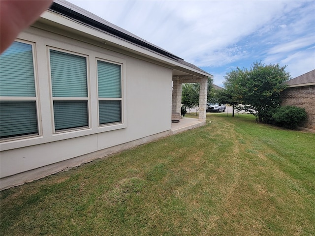 view of property exterior featuring a lawn