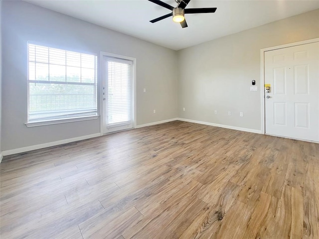 spare room with light hardwood / wood-style flooring and ceiling fan