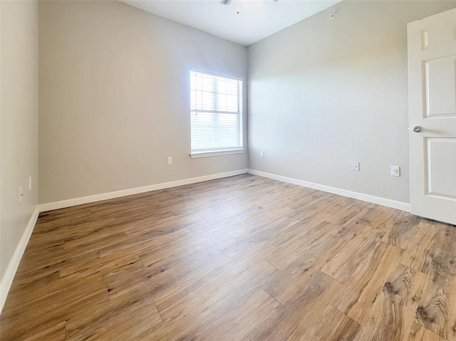 spare room with light hardwood / wood-style floors