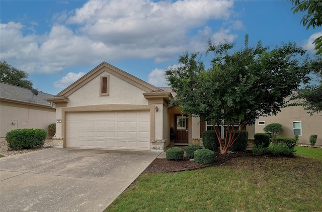 view of front facade with concrete driveway, an attached garage, and stucco siding