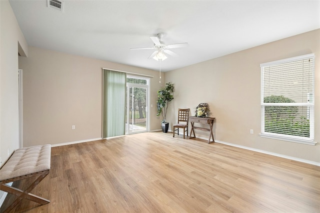 unfurnished room with light hardwood / wood-style flooring and ceiling fan