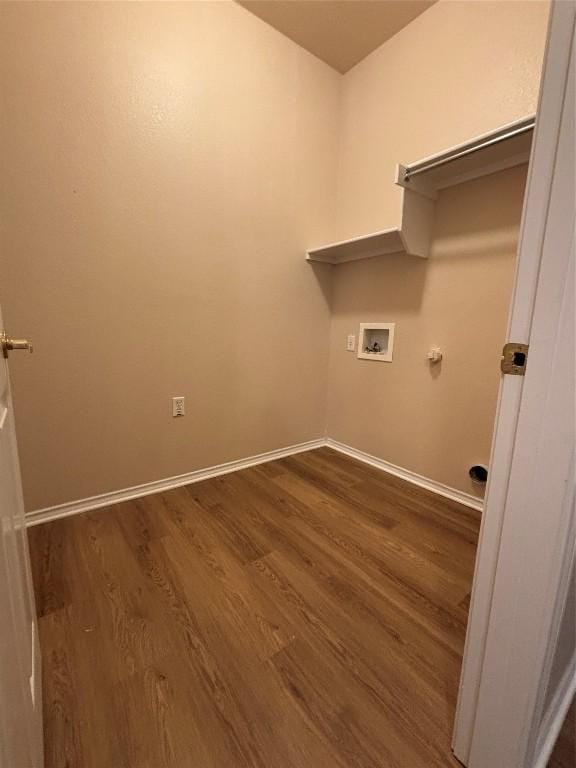 clothes washing area featuring gas dryer hookup, dark hardwood / wood-style flooring, and washer hookup