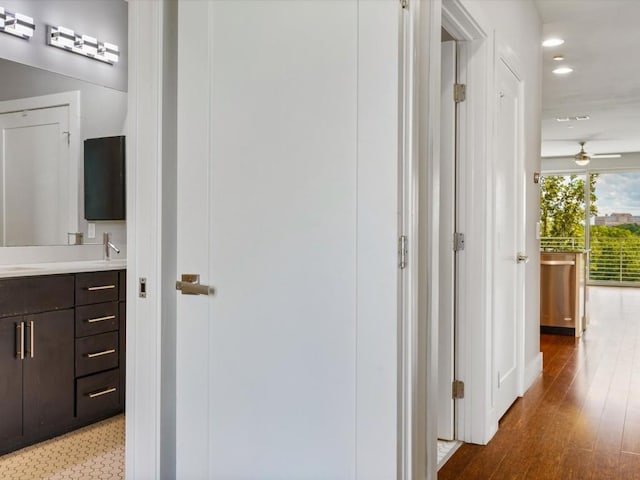 corridor with recessed lighting and wood finished floors