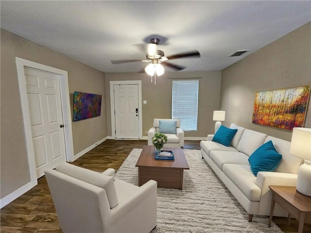 living room with ceiling fan and hardwood / wood-style flooring