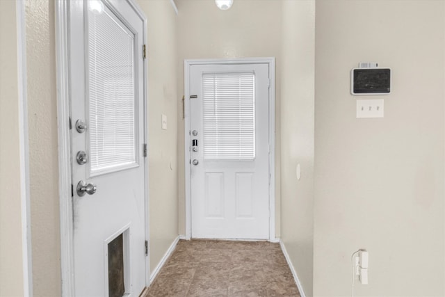 entryway featuring light tile patterned floors