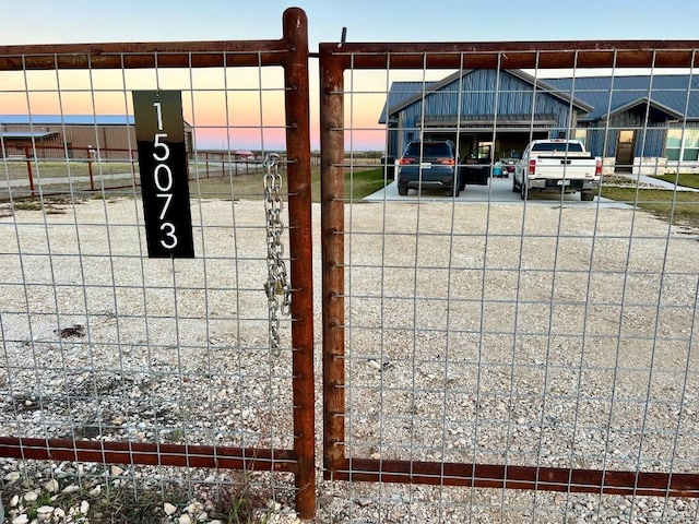 view of gate at dusk