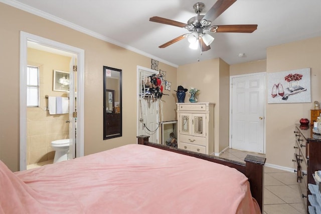 bedroom with ornamental molding, baseboards, ensuite bathroom, and light tile patterned floors