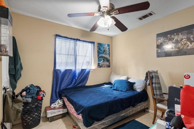 tiled bedroom with ceiling fan and visible vents