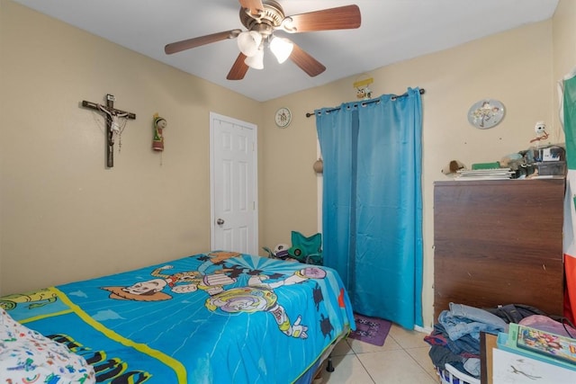 bedroom featuring tile patterned flooring and a ceiling fan