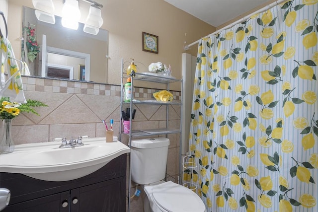 bathroom featuring toilet, a shower with curtain, tile walls, and vanity