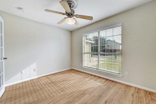 empty room featuring light hardwood / wood-style flooring and ceiling fan