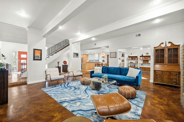 living room featuring beam ceiling and ornamental molding