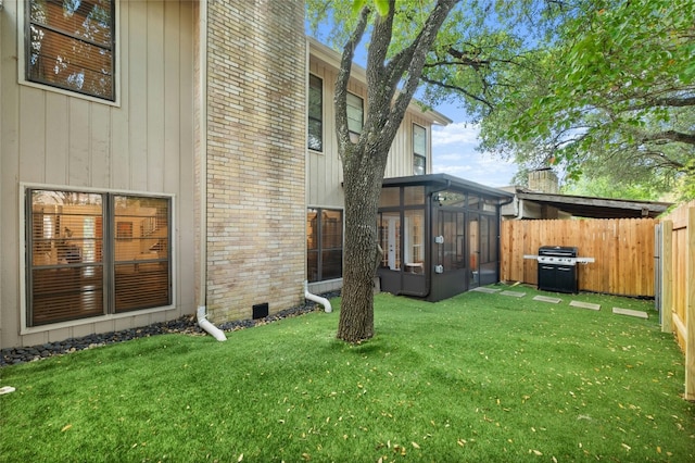 view of yard with a sunroom