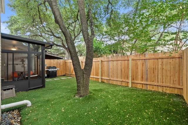 view of yard with a sunroom