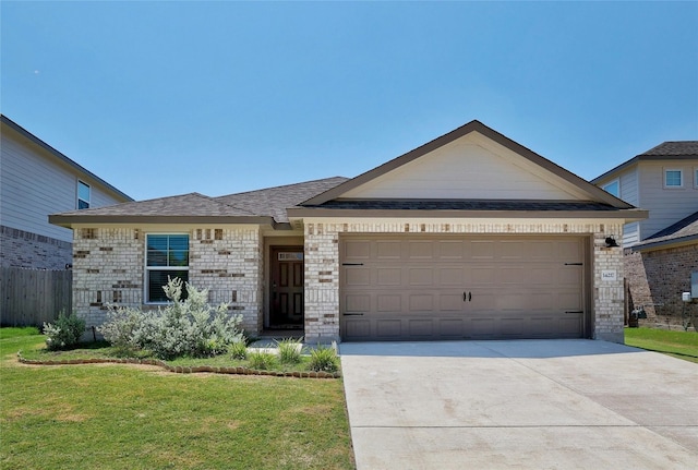 ranch-style home featuring concrete driveway, a garage, brick siding, and a front yard