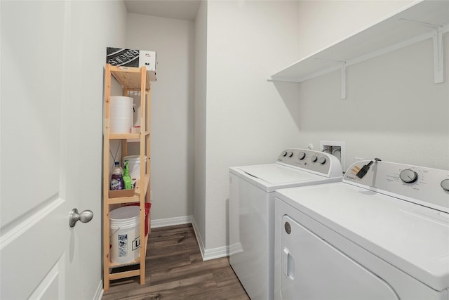 washroom featuring dark wood-style floors, laundry area, washing machine and dryer, and baseboards