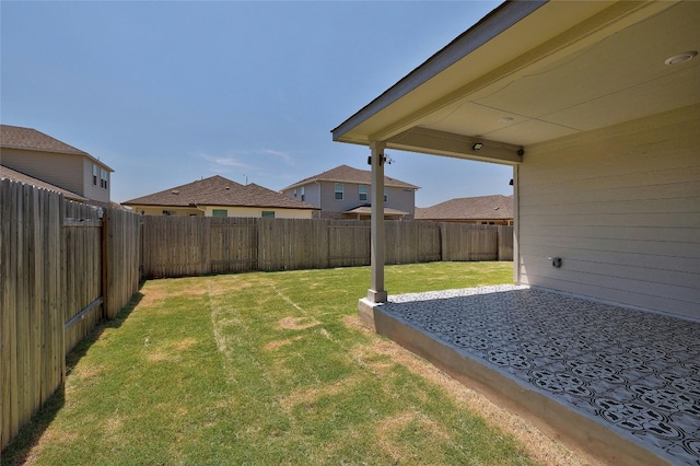 view of yard with a patio area and a fenced backyard