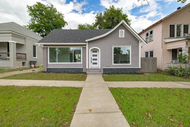 view of front of home with a front lawn