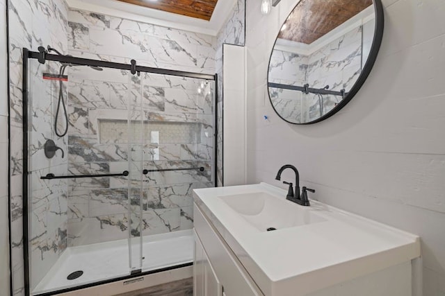 bathroom with vanity and a shower with shower door