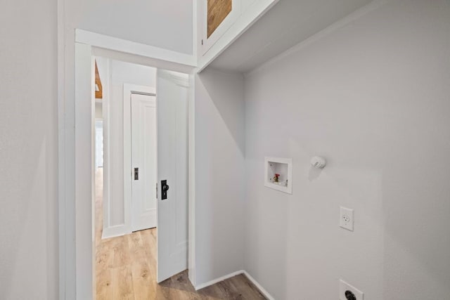 laundry area featuring washer hookup, hookup for an electric dryer, and light hardwood / wood-style flooring