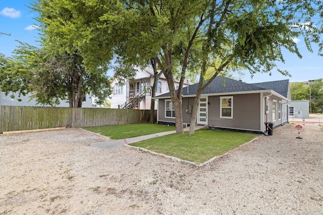 rear view of house with a lawn