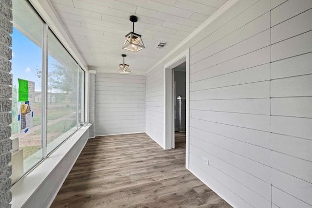 unfurnished sunroom featuring a wealth of natural light