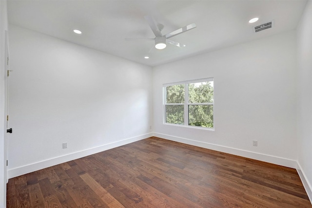 unfurnished room featuring ceiling fan and dark hardwood / wood-style flooring