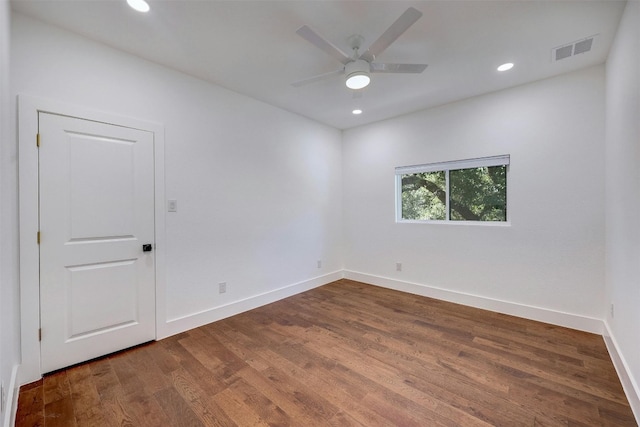 spare room featuring ceiling fan and hardwood / wood-style floors