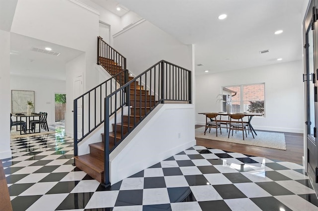 staircase featuring hardwood / wood-style floors