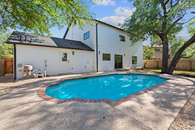 view of swimming pool with fence, a patio, and a fenced in pool