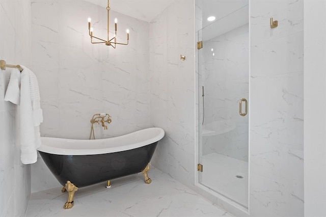 bathroom featuring shower with separate bathtub and a chandelier