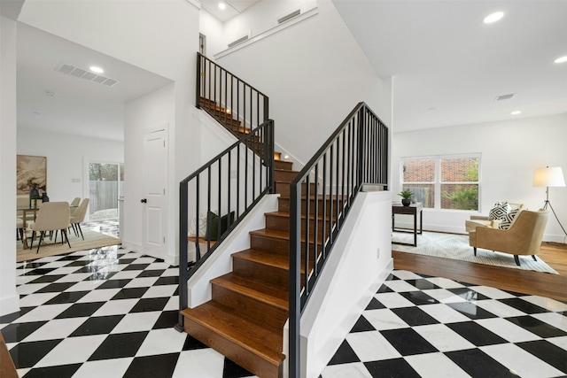 stairway with a high ceiling