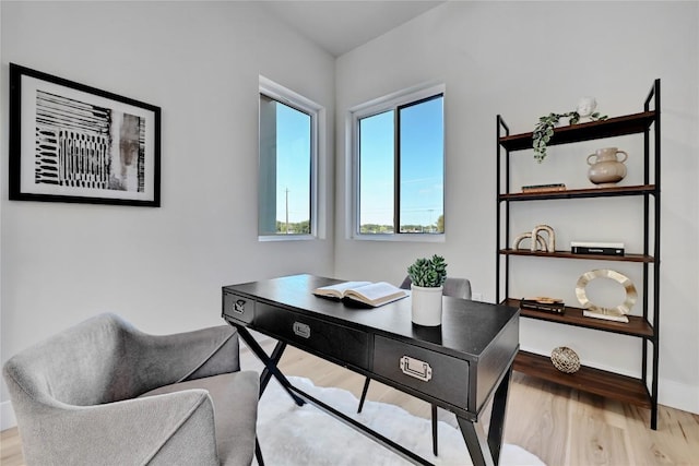 office space with light hardwood / wood-style flooring