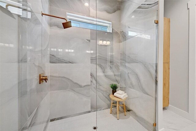 bathroom with a shower with shower door