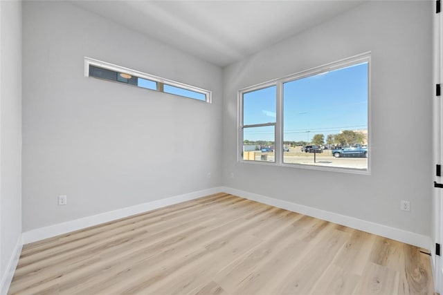 unfurnished room featuring light hardwood / wood-style floors