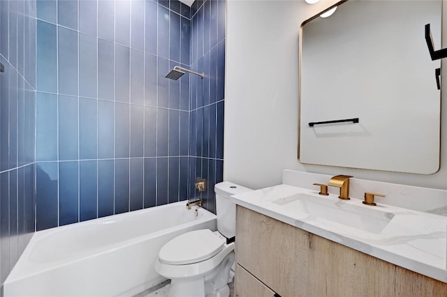 full bathroom with vanity, toilet, and tiled shower / bath