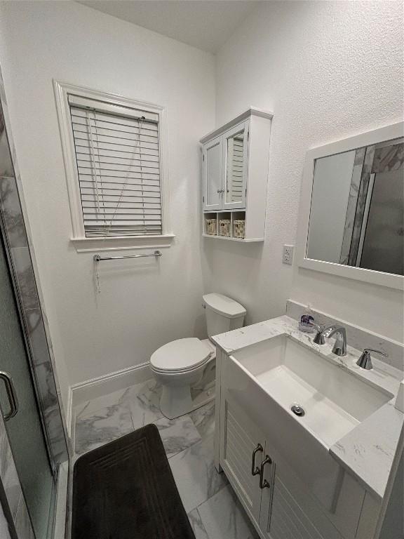 510 S Church St, Georgetown, TX 78626 - full bath with marble finish floors, vanity, and a stall shower