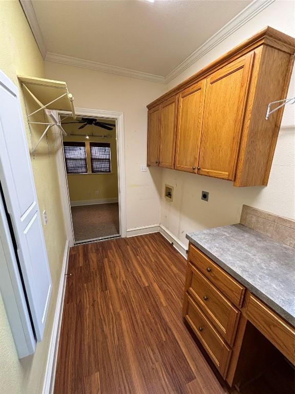 510 S Church St, Georgetown, TX 78626 - laundry area featuring cabinet space, hookup for a washing machine, hookup for an electric dryer, ornamental molding, and dark wood finished floors