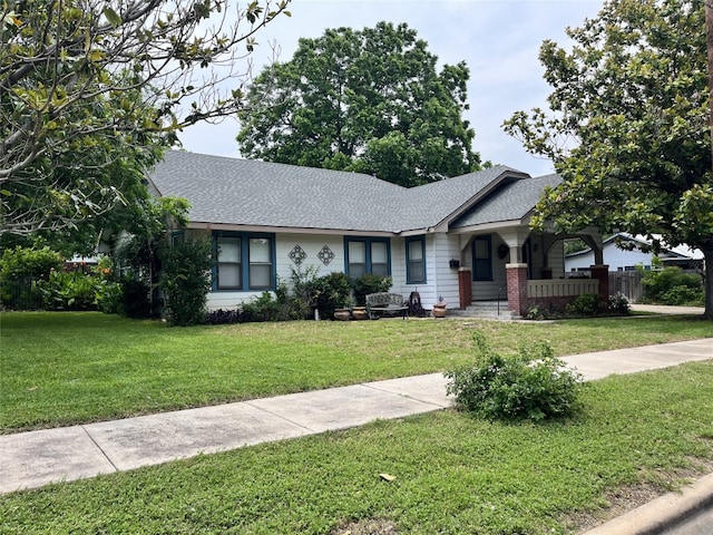 510 S Church St, Georgetown, TX 78626 - view of front of property featuring a front yard and roof with shingles