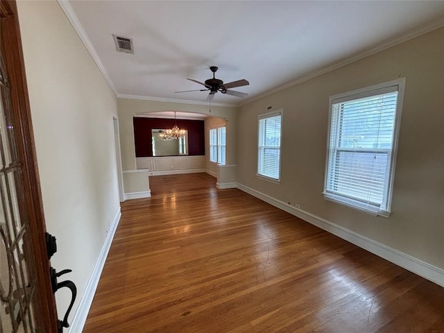 510 S Church St, Georgetown, TX 78626 - unfurnished living room with a chandelier, wood finished floors, ceiling fan, and ornamental molding