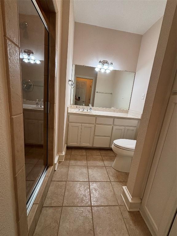 510 S Church St, Georgetown, TX 78626 - full bath featuring a shower stall, vanity, and tile patterned floors
