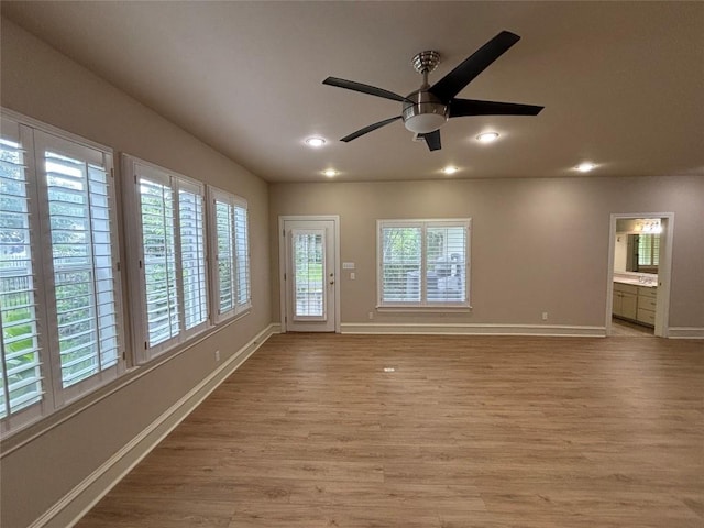 510 S Church St, Georgetown, TX 78626 - unfurnished living room with light wood-style flooring, ceiling fan, and recessed lighting