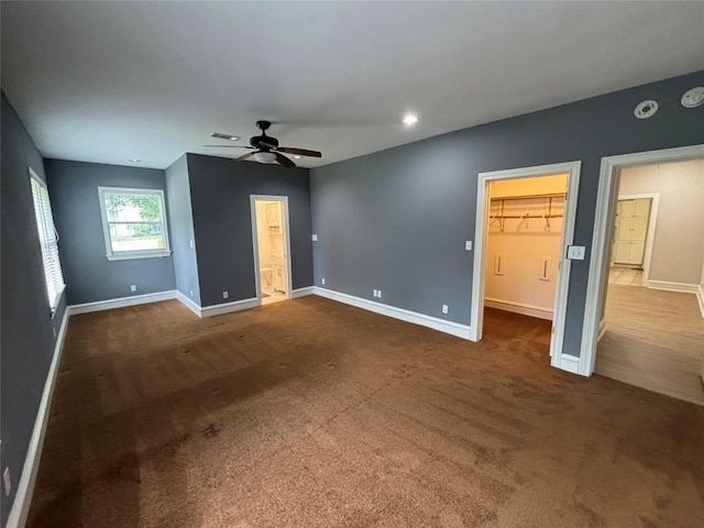 510 S Church St, Georgetown, TX 78626 - unfurnished bedroom with dark colored carpet, a spacious closet, ceiling fan, and recessed lighting