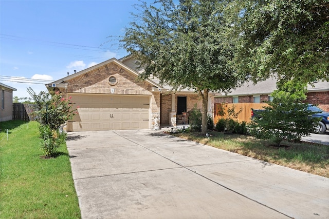 view of front of home with a garage and a front yard