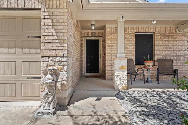 entrance to property featuring covered porch