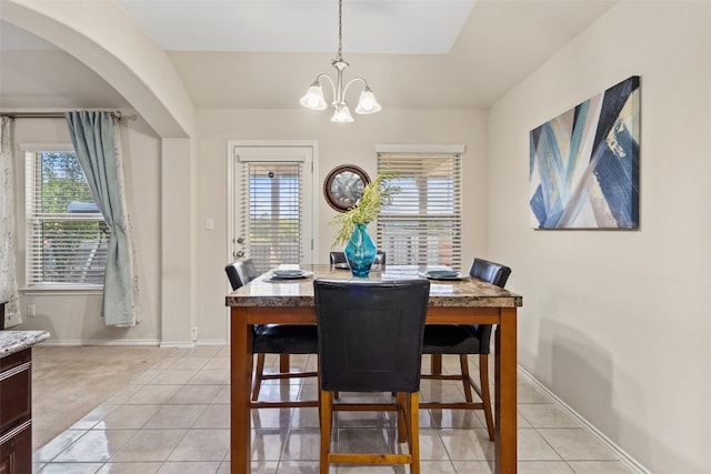 dining room featuring an inviting chandelier and light tile patterned flooring