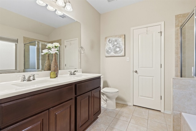 full bathroom featuring vanity, vaulted ceiling, separate shower and tub, tile patterned flooring, and toilet