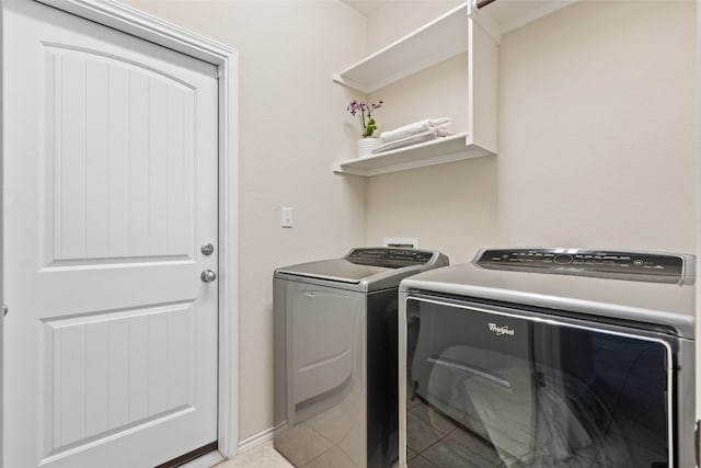 washroom featuring washer and dryer