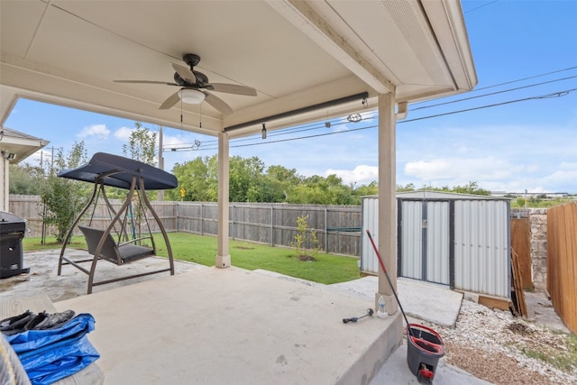 view of patio / terrace featuring ceiling fan and a storage unit